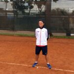Shain Lewis on a tennis court