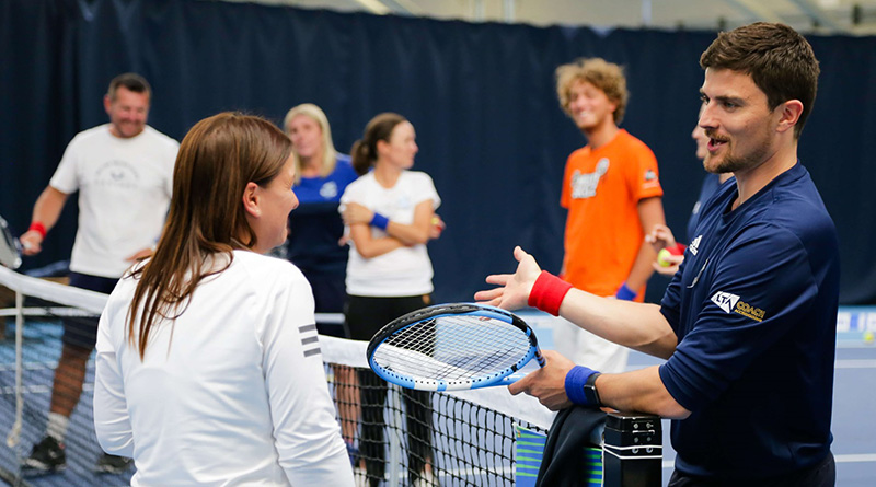 LTA coach talking to a player during a tennis session (credit: LTA).