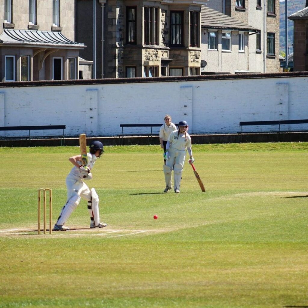 Olivia playing cricket