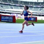 Kaitlin running around Stade de France