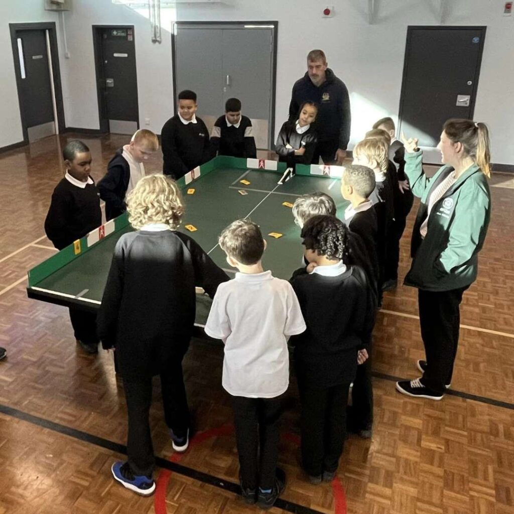 Kids and Darren playing table cricket